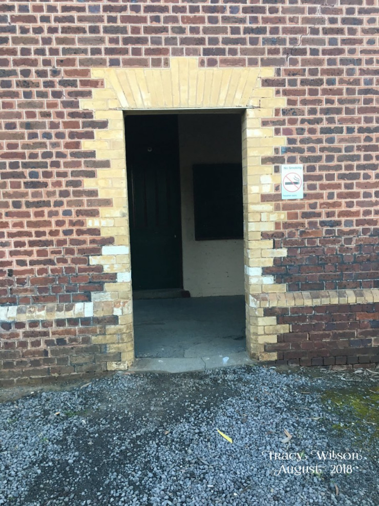 External doorway with brick quoining