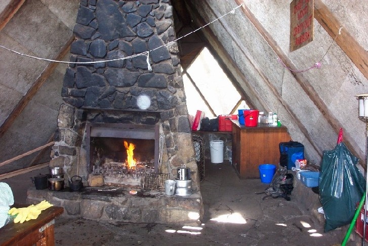 h00046 gantner hut interior with fireplace feb2005 as 006