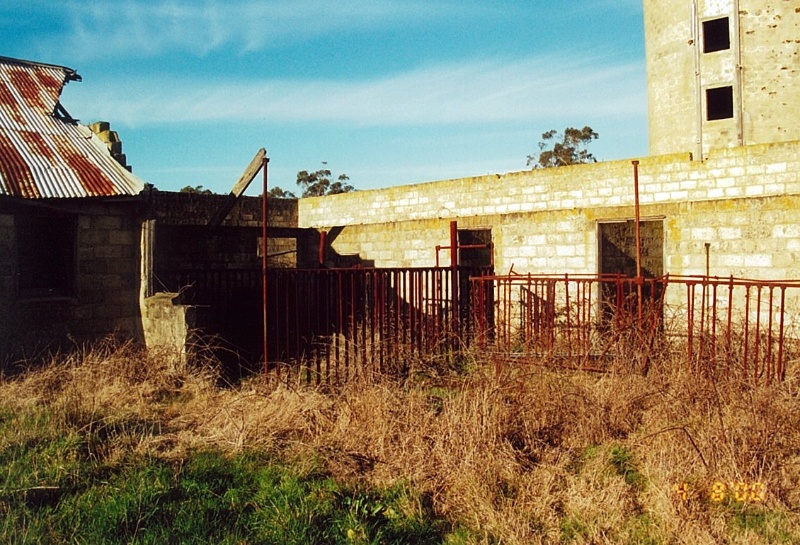 View between milking sheds at rear, near silo