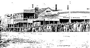 Former unicorn hotel - 1978 The Corner, Sturt Street, Ballarat, c.1866. The Unicorn Hotel can be seen to the centre left of the photograph, behind the brace of stockbrokers and their clients. The front brick facade can be seen clearly, before the erection