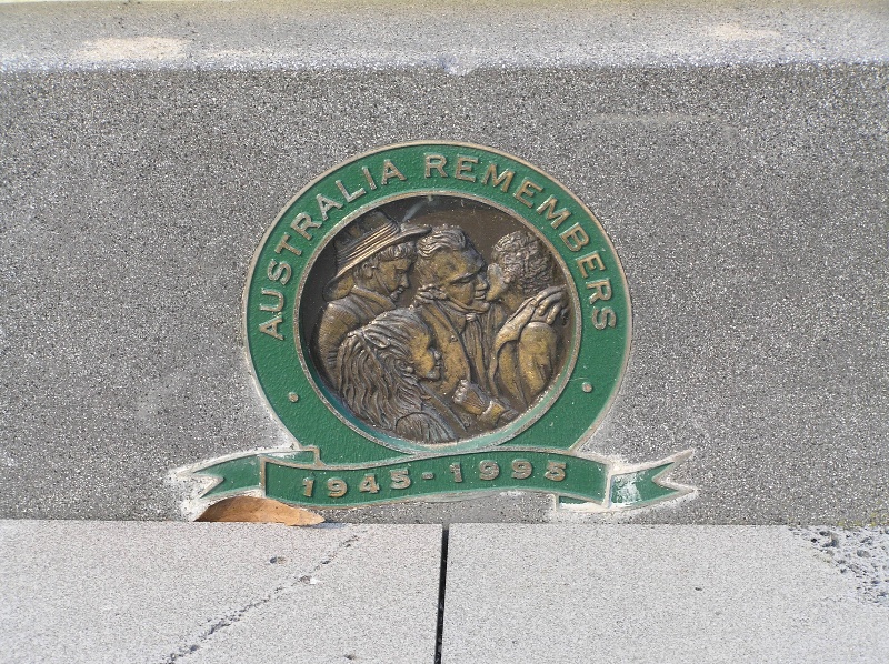 Australia Remembers plaque on the introduced concrete base of the Lorne War Memorial. Source: David Rowe, 2008.