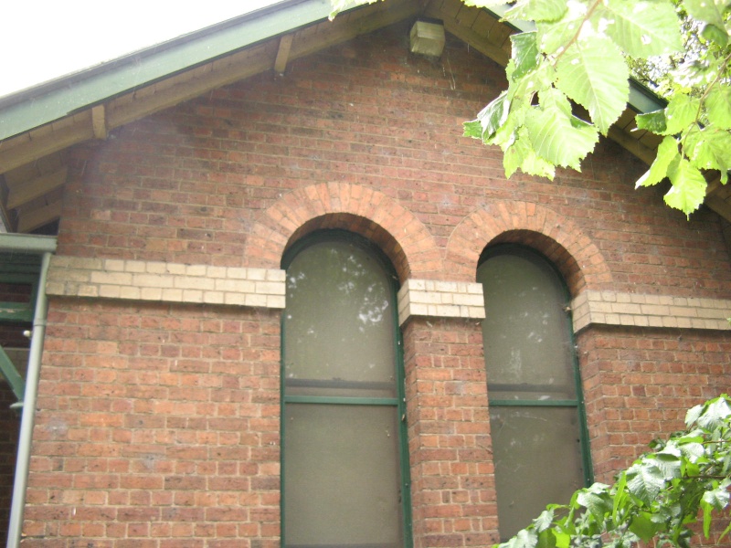 segmental arched window pair to facade