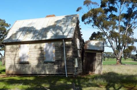 West elevation, note partially detached entrance porch.