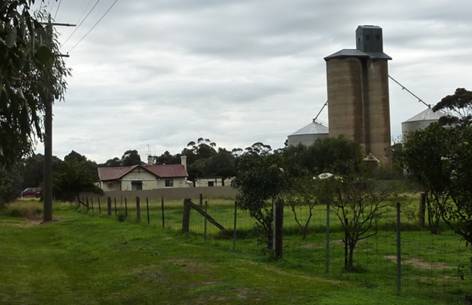 East elevation, with grain silo at rear.