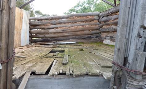 Raised floor and remnant mud and brick pugging to the eastern store