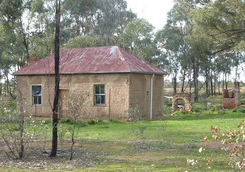 Kelly Cottage, west and south elevation of the cottage, note ruins of former kitchen at rear