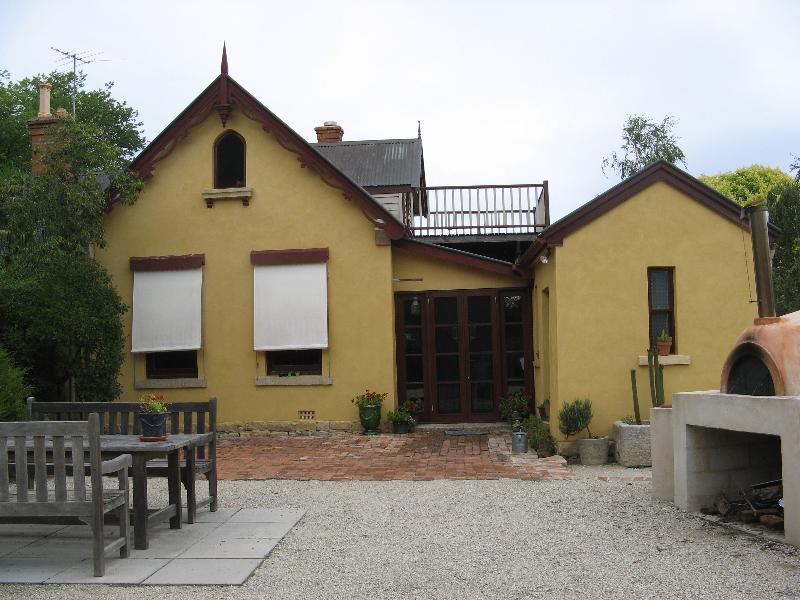 view from north, kitchen on right, infilled breezeway between it and house