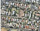 Photo 24: Aerial view of precinct showing private gardens. Note the central large private gardens on the north side of Stephen Street (centre) with mature exotic trees at the rear. Source: NearMap, 29 October 2015, City of Greater Geelong.
