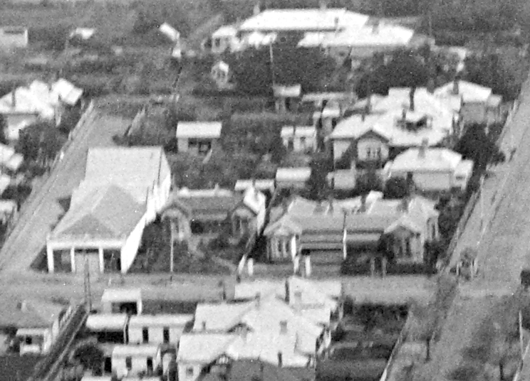 Figure 4: Aerial view of Newtown looking west showing the dwellings at 321-323 Shannon Avenue (right) and the omnibus stables (left), October 1927. Source: C. Pratt, La Trobe Picture collection, State Library of Victoria, accession H91.160/911.