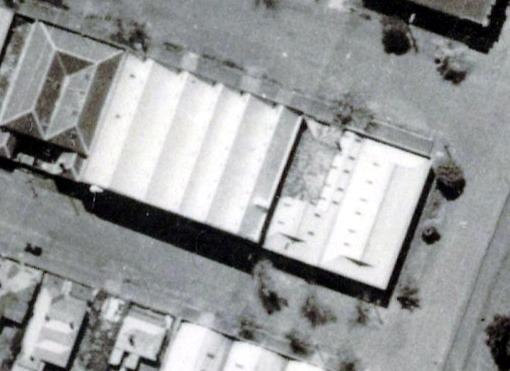 Fig 5. Aerial view showing corner site (right) with gambrel-roofed buildings, n.d. [c.1940s].