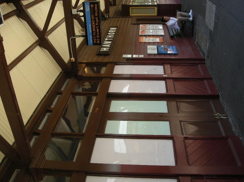 Platform 1 - timber-framed glazed doors, sidelights and early wall-mounted Station nameboard