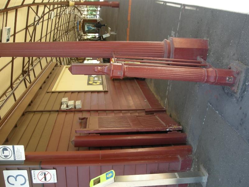 Painted cast iron and timber fence and gate components beneath the northern end of the Platform 2 and 3 canopy