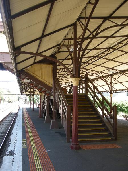 The roofed footbridge and its access stairs links the two Platforms at their mid-points