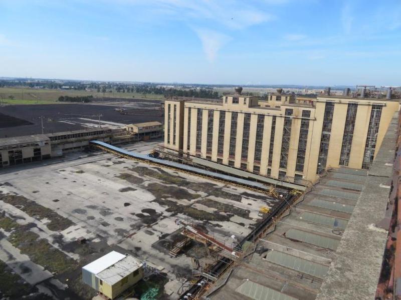 View northeast from the top of No.1 Briquette Factory looking at side of the Briquette Factory (right) and the collecting and feeding conveyors (left)