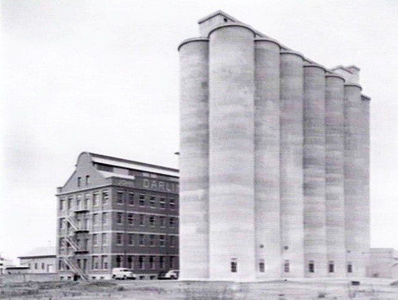 c 1940 depicting the south-west fa ade of the complex including the 1926-7 storehouse and mill building and the 1939 reinforced concrete silos