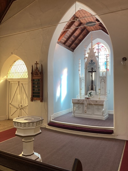 Altar with baptismal font in the foreground